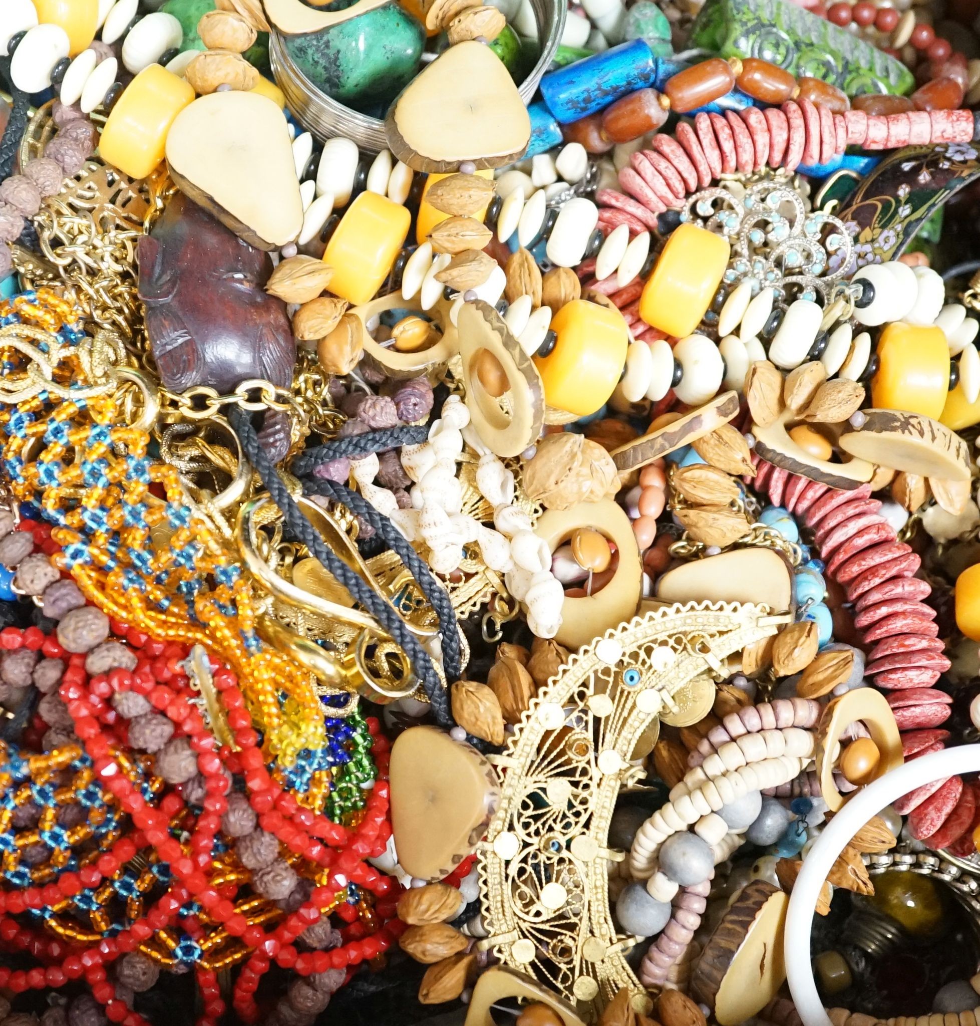 A large quantity of assorted costume jewellery including various necklaces etc.